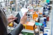 Manufacturing professional monitoring operations with digital tools powered by Elevate Technology IT solutions.