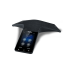 Elevate Technology image of a black Yealink CP925 conference phone with a sleek, T-shaped design, fabric grille, and color touchscreen interface, showing the time 23:59.